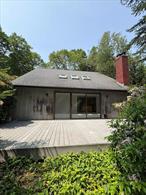 Amazing opportunity to own in the Hamptons. Nestled on a shy acre, this contemporary is more than meets the eye! What was once a rolling landscape of Botanical gardens now holds endless possibilities. The property still holds the blue prints of the gardens that once covered the landscape with existing privacy trees and flowering shrubbery, stone walls, slate patios and a pergola. Don&rsquo;t let the property distract you from what the home has to offer! Open floor plan, drenched with natural light, 3 large bedrooms, 2 full renovated baths, large eat in kitchen, cabinets galore and granite counter tops. Hardwood floors, recessed lighting, wood burning fireplace and so much more at this amazing low price!