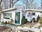 LOCATION, LOCATION!!!  CHARMING PORT JEFF VILLAGE COTTAGE. UPDATED COTTAGE IN IDEAL SETTING MINUTES FROM THE TOWN OF PORT JEFFERSON ON LOVELY CORNER LOT. LOT HAS MEANDERING STONE PATHS, CUSTOM LANDSCAPING, A LARGE SHED, BACKYARD DECK AND GAZEBO FOR PRIVACY. AMPLE DRIVEWAY PARKING WITH COBBLESTONE APRON,  CUTE SUNPORCH ENTRY, EAT-IN KITCHEN WITH RETRO REFRIGERATOR AND APPLIANCES WITH SUNNY DINING AREA, GAS STOVE, UPDATED FULL BATHROOM, BEDROOM WITH CLOSET/STORAGE ALL WITH HARDWOOD FLOORS. BONUS ROOM/OFFICE. LOWEST TAXES IN PORT JEFFERSON WITH ALL THE AMENITIES THE TOWN OFFERS. SEPARATE HW HEATER. IGS AS IS. NEW SEWER LINES PUT IN AND ROOF IS FROM 2021. TRULY A UNIQUE HOME/PROPERTY. WHY RENT WHEN YOU CAN OWN FOR LESS? CALL TODAY!