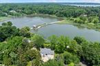 A special Waterfront retreat nestled along Puppy Cove of Lloyd Harbor. Perfectly positioned to capture sweeping views of Huntington Harbor and the historic Van Wyck-Lefferts Tide Mill, this beautifully renovated Contemporary residence offers a rare blend of modern sophistication, architectural interest, and natural beauty. Set on just over 2 acres, this meticulously landscaped property affords exceptional privacy and tranquility surrounded by specimen plantings and perennial gardens. Expansive new windows throughout the home frame captivating water views from nearly every room, inviting natural light to fill the open, airy interior. Thoughtfully designed living space, including a full spacious walk-out lower level with a separate bedroom and bath. The primary bedroom offers a huge walk-in closet with a gorgeous en suite bath. For outdoor enthusiasts, the property offers a private oasis with a spacious deck, a private beach, and plenty of room for outdoor dining and recreation. This unique waterfront property offers direct water access to Huntington Harbor and the Bay. Enjoy your own private beach! Acclaimed CSH SD#2. Just moments to Vibrant Huntington Village and Cold Spring Harbor Village, enjoy nightlife, restaurants.