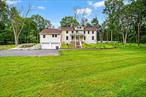 This colonial-style home centrally located in the clarkstown central school district with well over an acre of freshly landscaped property. The first floor boasts a spacious living room with a wood- burning fire place, a large dining room and a fully updated eat-in kitchen featuring wood cabinets, granite countertops and stainless steel appliances. Additionaly there is an updated full bath, a laundry room and an enclosed finished porch with a door leading to a patio that overlooks the expansive backyard. On the second floor there are 3 bedrooms plus a den and a full bath room. There is ample storage space in the basement plus an attached two-car garage and plenty of parking in the drive way. Conveniently located near schools, shopping centers, parks and major road ways.