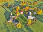 Extraordinary 186-Acre Colonial Estate with Views, Water Features & Endless Potential! Hamptonburgh, NY, a rare Hudson Valley legacy property! This historic 4-bed, 3-bath Center-Hall Colonial sits on 186 stunning acres across 3 parcels, offering sweeping panoramic views reaching as far as High Point, NJ and Sugar Loaf Mountain. Located just 0.9 miles from the Campbell Hall Metro-North Station, the property combines unmatched privacy with commuter convenience and proximity to local attractions. The main home blends timeless charm and modern upgrades with exposed hand-hewn beams, refinished wide plank floors, crown molding, and a gourmet kitchen with granite counters, stainless appliances, and custom cabinetry. Formal living and dining rooms feature pocket doors and intricate period detailing, while the upstairs offers 4 spacious bedrooms including a cozy bunk room and luxurious baths with a soaking tub and stall shower. Enjoy dual-fuel heating options with both an oil-fired system and an outdoor wood-burning furnace. The setting is low-maintenance, with the option to renew an existing farm leaseâ€”leaving you responsible only for lawn care around the home. This property is a true outdoor retreat, featuring a private bass pond, creek frontage, hunting, and gently rolling fields framed by woodlands. Additional features include: Original hand-hewn barns, A 48-stall dairy barn, Oversized 3+ car garage with workshop, Multiple storage buildings, A fully approved and private kennel, A separate caretakerâ€™s studio with full kitchen and bath! Whether you envision a private residence, equestrian estate, working farm, or unique venue, the possibilities are endless. With spectacular views, natural beauty, and over 200 years of history, this is a once-in-a-lifetime chance to own a signature Hudson Valley estate. Only 1 hour to NYC and 35 minutes to Northern NJâ€”private yet close to everything.