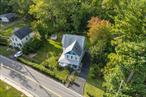 Discover the perfect blend of historic charm and modern convenience in this beautifully updated Folk Victorian home, set on over half an acre in the desirable Valley Cottage. Built in 1880, this 4-bedroom, 3-bathroom home offers 2, 260 square feet of thoughtfully designed living space.Inside, original floors, classic moldings, and two fireplaces create a warm and inviting atmosphere. A three-story addition (2003) adds valuable space, including a relocated laundry room and additional bathrooms. Updated Kitchen (2003): Quartz countertops, stainless steel appliance, and custom cabinetry - New Roof & Insulation (2005): Improved energy efficiency and durability - Outdoor Retreat (2020): Multiple covered porches, mature landscaping, and a private yard - Central Cooling & Gas Heating: Year-round comfort with updated heating and cooling systems Prime Location: Minutes from shopping, dining, and Hudson River recreation Easy commute to NYC & major highways