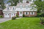 This classic colonial is located on a picturesque street in the village of Flower Hill, and has been meticulously maintained and updated throughout the years. This sunny home has original custom millwork, beautiful hardwood floors, and an inviting circular flow perfect for entertaining. The spacious and inviting living room has wood burning fireplace and original random width pegged oak floors leading to a charming room that is perfect as an office, music room or library. There is a graciously proportioned formal dining room Family room has cathedral ceiling with oversized windows overlooking the rear gardens and terrace. Sunny rear foyer with skylights connects the family room, dining room and kitchen to the outdoor entertaining terrace and patio .Kitchen has oak cabinets, new appliances and large breakfast area. The primary bedroom is generously proportioned with his and her closets and features new primary bath. The second bedroom offers privacy with  an ensuite bath. Third and fourth bedrooms are beautifully sized with new hallway bath. There are two bonus rooms on the third floor with full staircase off the main hallway. The basement is a hidden treasure and features original recreation room with working brick fireplace, oversized windows, outdoor access, and large unfinished storage the full footprint of the home. The property is perfect for entertaining with dining terrace and bluestone patio overlooking the private landscaped grounds. Award winning school district, close to both local shopping in town and Americana Manhasset, and walking distance to the Long Island Railroad.  Great opportunity to make this beautiful classic colonial home your own!
