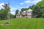 Discover the perfect combination of a quiet cul de sac setting, 2.2 acres of peaceful and private property and over 2700 square feet of living space in this colonial style home. Curb appeal begins at the driveway, with the home thoughtfully positioned off the road and a covered front porch welcomes you. Enter into a neutral and light filled interior boasting elegant and custom accents in the formal spaces including arched doorways, tray ceiling and inlaid hardwood floors. The open floor plan is perfect for entertaining and the heart of the home is found in the family room with modern vaulted-ceiling and gas fireplace as a focal point. The spacious eat-in kitchen features granite countertops, rich wood cabinets, tile backsplash, stainless steel appliances including gas stove, and an oversized pantry. Upstairs, retreat to the expansive primary suite offering two walk-in closets and an ensuite bath, complete with a jetted tub. Hardwood floors run throughout the bedrooms and the bonus room offers flexibility to use as home office, guest or bedroom, creative space - or all of the above! Full basement can easily be finished for even more square footage and a new well pump and brand new pressure tank are just a couple of recent improvements. Prepare to party on the huge deck overlooking park- like property and roast marshmallows over the gas fire pit. Plenty of room to roam as this large, level backyard backs to woods for privacy. Wallkill school district and this serene setting in the town of Newburgh will make you feel like you are away from it all while being in an ideal commuter location just minutes to train and bus to NYC, highway, shopping, restaurants, area attractions and more.