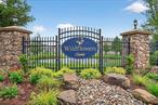 Welcome to 84 Jasmine Dr. in the highly desirable Wildflowers at Wallkill, a premier 55+ gated community offering resort-style living. This stunning 2011-built home features 2 bedrooms, 2 bathrooms, and an abundance of luxurious upgrades throughout. Step inside to a bright and spacious open floor plan with gorgeous Brazilian hardwood floors and elegant crown molding and wainscoting. The custom kitchen is a chefâ€™s dream, featuring CAFE&rsquo; black stainless steel appliances, custom wood cabinetry, granite countertops, an island, and a cozy breakfast nook, all seamlessly flowing into the living room. At the heart of living room is a gas fireplace. Custom pleated shades add a sophisticated touch to every room. The primary bedroom offers two generous walk-in closets and an ensuite bathroom with a walk-in shower and a double vanity. The second bedroom is perfect for guests or as a versatile space. The laundry/mud room off the garage includes Samsung front load washer and dryer and utility sink for added convenience with access to the 2-car garage. Enjoy outdoor living on your private stamped concrete patio, surrounded by a tree-lined backyard â€“ perfect for BBQs and relaxation. This community offers first-class amenities, including a 7, 500 sq. ft. clubhouse, indoor lap pool, outdoor in-ground pool, fitness center, tennis courts, a library, and billiards and banquet room. Wildflower residents can participate in various social activities including arts and crafts and holiday parties. Conveniently located near Rte. 211- main corridor of shopping, dining, and transportation, with easy access to NJ Transit, I-84, and I-86. A truly exceptional opportunity to enjoy the very best of 55+ living! Donâ€™t miss your chance to own this pristine home in the Wildflowers at Wallkill.