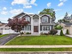 Luxuriously Remodeled, and Significantly Expanded Colonial Home in Plainview offers luxurious living with 6 bedrooms, 4.5 bathrooms, and a fully finished basement with a full bath and separate entrance. The grand double-height entry sets the tone for the spacious and open layout.The first floor features a stunning custom eat-in kitchen with a large center island, stainless steel appliances, and an adjoining family room with a gas fireplaceâ€”perfect for entertaining. A junior en-suite bedroom on the first level provides ideal space for guests or multigenerational living.Second Floor the oversized primary master bedroom includes a spa-like bath and a walk-in closet. Four additional large bedrooms, a full bathroom, and a convenient second-floor laundry room. Crafted with exceptional workmanship and high-end finishes throughout, this move-in ready home is located close to transportation and shopping, and is zoned for the desirable Plainview-Old Bethpage School District.