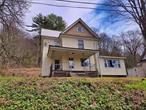 Overlooking the East Branch of the Delaware. This fine home has 3 bedrooms and large open living and dining areas. Located a short walk from downtown Hancock yet set up a bit from the road affording privacy. Metal roof covers the main house for years of low maintenance. Kitchen has a breakfast bar and newer appliances.
