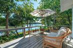Rental Permit # 0966 Fantastic home set directly on Great Pond and a block (975 feet) from Kenney&rsquo;s Beach with restaurant Little Fish just around the corner. This bright 3 bedroom and 2 full bathroom, with a 3 season room all window porch home has an expansive rear deck overlooking the fresh water pond. Watch osprey dive bomb for fresh water bass while geese, ducks and egrets meander across the water. In the evening, take in spectacular sunsets from the large bay window facing directly west or from the beach itself.