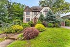 Beautiful Tudor style colonial in prime Woodmere location! 4 bedrooms upstairs, 2.5 baths. Finished basement, CAC, gas heat, large attic for storage. Slate roof maintained annually, magnificent curb appeal. Low taxes. Come check it out before itâ€™s gone!!