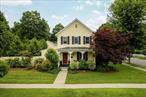 Welcome to the Buttercup House, a quintessential Rhinebeck Village home, at 38 Chestnut Street in the heart of Rhinebeck Villageâ€™s Historic District. A generous corner lot in an exceptional location, this home is a classic Folk Victorian Farmhouse, with a full length covered front porch, lush perennial landscaping, and a spectacular private back yard. Featured in â€œHGTV Magazine, â€ this home has been meticulously renovated, restored, and updated for a contemporary lifestyle while maintaining the charm and architectural details that honor its history. Stepping into this home and through the front foyer, the main floor has a warmly inviting living room, a formal dining room with a bay window and window seat, and a modern yet classic kitchen with a Wolf induction range and Bosch appliances, which leads to a rear mudroom and rear entry. A front to back hallway also connects a main floor half bath, laundry room, and private den which leads to a side yard pergola-covered bluestone patio with stone wall. Upstairs, two bedrooms share a hallway bath while the primary suite offers a bedroom with a bay window, dressing room, walk-in closet, and ensuite bath. Outside, the fully fenced back yard offers a private and gorgeously landscaped retreat with an additional bluestone patio plus a path that leads from the back of the home to a driveway and Carriage House. The Carriage House features spaces for 2 cars and storage on the first level plus 600 square feet of additional space on the second level. Easy walking distance to all of the amenities that Rhinebeck has to offer, and 5 minutes to the Amtrak station in Rhinecliff.