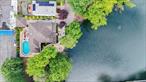Welcome to 66 Normalee Road, a one-of-a-kind custom-built residence situated on a sprawling 169x100 sq ft lot at the very end of a peaceful dead-end street. This exceptional property offers rare privacy and tranquility, with breathtaking, unobstructed views of Cameron Lake just steps from your front door. This spacious home boasts over 6000 sq. ft of living space, 4 generously sized bedrooms, including a luxurious primary suite complete with a private en-suite bathroom. The heart of the home is a stunning, modern kitchen featuring high-end appliances, perfect for both everyday living and entertaining. A fully finished (2000 square ft) basement, ideal for a media room, home gym or playroom with a separate entrance to side yard. Step outside to your private backyard oasis with a sparkling pool, large deck, and a detached garage - perfect for summer gatherings or quiet evenings by the water. With its prime location, premium features, and unparalleled setting, 66 Normalee Rd offers a rare opportunity to own a lakefront home in Staten Island. Grasmere is a highly sought after Staten Island community with beautifully maintained homes, accessibility to shopping & dining, and proximity to the well known Staten Island Academy & Poly Prep Country Day School among many other options. Grasmere also has New York City&rsquo;s only private lake with resident-only beach club and is only minutes to VZ Bridge. Don&rsquo;t miss your chance to make this special property your forever home!