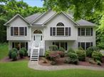 Nestled on 3 serene and wooded acres in the Town of LaGrange, this beautifully maintained contemporary bilevel offers space, versatility, and privacy. The main level features a bright and airy layout with cathedral ceilings and gleaming hardwood floors that flow through the spacious living and dining rooms. The eat-in kitchen boasts an abundance of maple cabinetry, a center island, and a tiled floorâ€”ideal for both everyday living and entertaining. With 4 bedrooms and 3 full baths, including a primary en suite, there&rsquo;s room for everyone to spread out. The lower level offers a generous family room with a cozy wood-burning fireplace, walkout access, and an additional den or home office space. One of the standout features of this home is the legal accessory apartment, complete with its own private side entrance, living room, kitchen/dining area (all appliances in apartment convey), bedroom, and full bathâ€”perfect for extended family or guests. Recent updates ensure peace of mind and comfort, including a new AC system and professional duct cleaning (October 2024), a new oil tank (January 2025), a well pump replacement (July 2019), new carpeting in both the primary and apartment bedrooms, and a newer refrigerator (2024), dishwasher, and range (2018). You&rsquo;ll have peace of mind with the well maintained equipment throughout this home including the furnace with an annual service contract and water softening system service contract. Enjoy the peaceful setting surrounded by mature trees while still being just minutes from all LaGrange amenities, including Stringham Park and James Baird State Park, Arlington schools, shopping, restaurants, and commuter routes. This property combines the tranquility of nature with the convenience of locationâ€”donâ€™t miss the opportunity to make it your own.