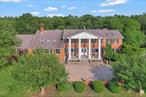 Great potential to embrace an equestrian lifestyle with immediate income producing potential. This Training Center features 29 acres of sprawling green grounds and incredible views. As you pass through the gated entrance, you will experience a world of equestrian wonder. The main barn boasts 13 stalls and an attached 75&rsquo;x133&rsquo; indoor arena with sprinkler system, over $500, 000 cost. Two large outdoor wash stalls with attached paddock and three outdoor stalls with one indoor wash stall both equipped with convenient hot and cold water access. The lower barn further enhances the facilities with 15 stalls and an outdoor wash stall. There are 5 outdoor stalls thoughtfully paired with attached paddocks and an additional water access. The presence of 3 run-in sheds and 21 paddocks ensures that your horses have plenty of space to roam and relax. Whether it&rsquo;s dressage or jumping the two outdoor riding arenas both with sprinkler systems and footings are perfect for refining your equestrian skills. The main home is 6460 Colonial featuring 5 bedroom, 5 full baths, 2 kitchens and the list goes on. Come make it your dream home