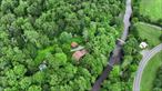 Willowemoc Lodge â€“ A World-Class Trout Fishing Estate on the Willowemoc River. A once-in-a-generation opportunity awaits in the heart of the southern Catskills: welcome to Willowemoc Lodge, an extraordinary 21.6-acre estate boasting an unrivaled 2, 500 feet of private frontage along the fame d Willowemoc Riverâ€”one of the most iconic and celebrated fly fishing destinations in the Northeast. Whether you&rsquo;re a seasoned angler or a nature lover seeking a rare retreat, this property is a dream realized. Own a section of river that others only dream of fishing, with wild trout rising in your backyard. Private river access of this magnitude is virtually unheard ofâ€”making this a true trophy property and the envy of the Catskills. Connected by a custom-designed one-car bridge that spans your private stretch of river, the estate rises into the mountains where a spectacular lodge-style home and multiple outbuildings await. The main residence features gleaming hardwood floors throughout, a dramatic beamed ceiling, an oversized stone fireplace, and a wood-burning stove, all capturing the warmth and grandeur of mountain living. Walls of windows overlook the river, flooding the interior with natural light and panoramic views. Two expansive levels of decking invite you to relax, entertain, and soak in the sounds of the river below. For the ultimate in relaxation, the home also features a private sauna.The land itself is bursting with natural beautyâ€”lush perennial gardens, wild blackberry bushes, and vibrant seasonal flowers surround you, offering year-round color and privacy. Additional structures include a charming guest house, a cozy guest shed, a garage, and a fully equipped workshop, (shop equipment not included) offering versatile space for hosting, creative pursuits, or storage. These outbuildings not only enhance the propertyâ€™s functionality but also present incredible potential for short-term rental income. Whether you envision a private family compound or a boutique Airbnb retreat for fly fishing enthusiasts and outdoor adventurers, the estate is perfectly suited for both personal enjoyment and revenue generation. Rarely does a property of this scale, beauty, and exclusivity come to market. With its unmatched river access, rustic luxury, and boundless possibilities, Willowemoc Lodge is more than a homeâ€”itâ€™s a legacy.