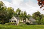 Tucked away on a quiet country road, this peaceful farmhouse sits on fifteen acres of native gardens, expansive lawns, wildflower meadows, blue stone patio and porches, and private forest with trails leading to the second spring-fed pond. Enter the house through an airy mudroom, then the Great Room lays out before you. The patio and pond draw you to the far end of the room, where French doors let you out to this idyllic space. The vaulted ceiling, wood-burning stove & exposed beams add to the charm. The open kitchen was designed by a chef, with soapstone counters, a center cooking island, classic cabinetry, and multi-use oven and stove. The farmhouse sink connects the kitchen to the light-filled dining room, giving the first floor a loft-like feeling and flow. There are two full baths on the first floor and three bedrooms, all with French doors leading out to the deck. There is a large, private living space on the second floor, which the owners use a primary bedroom. It has French doors opening out to a juliet balcony with views of the pastoral property. Over the past fifty-five years, the house has had two owners who have lovingly cared for the property. Starting in 1970, the first owner bought more land and seamlessly added onto the original 1880â€™s farmhouse with new living quarters. Since 2015, the current owners renovated the house with new roofs, insulation, sheet rock, painting, electrical, two new furnaces, air conditioning, washer-dryer, water well, filter, plumbing, irrigation, stone masonry, septic, and fiber optic. They extensively relandscaped the grounds with local arborists and gardeners to cultivate perennial, native plantings, while preserving historical, specimen trees.54 Fowler Lake Road is a turn-key property with idyllic charm. It is perfectly located, just minutes away from Art Omi, Bartlett House, Hawthorne Valley, Chatham, Kinderhook, Valatie, and 15 minutes to Hudson/Amtrak and 2 hours to NYC.