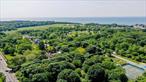 Discover the rare opportunity to own a cleared 1.48-acre flag lot, ideally situated 331 feet off the Main Road, offering ultimate privacy while remaining close to everything the North Fork has to offer. This set-back parcel is enveloped by preserved land, creating a serene and secluded setting for your future home. With the potential to accommodate a 4, 000+ square foot residence, complete with a pool and additional structures such as a barn/artist studio, pool house, or garage, this property offers exceptional flexibility for your vision. Utilities abut the property, streamlining the building process. Enjoy the best of both worldsâ€”peaceful privacy and prime proximityâ€”just minutes from Greenport Village, renowned beaches, and celebrated vineyards. Whether youâ€™re planning a year-round estate or a luxurious weekend getaway, this is a canvas ready for your custom build. Donâ€™t miss this unique opportunity to create your dream home in one of the North Forkâ€™s most desirable locations.