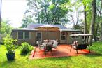 Want a comfortable summer/weekend getaway? Then check out this 3-season cottage, managed from April 15- October 15 in the Mohegan Lake area in a 40-unit community sharing 8 meticulously landscaped acres. Enter through the front lawn to a very large exterior concrete patio ideal for entertaining or that morning cup of coffee. Beyond this rustic patio enter into a classic kitchen with wooden cabinets, 24-inch range, and dine-in area. Continue to rear of home and set your sights on 2 large Bedrooms each with wood floors, a generous size closet and wood paneled walls throughout. Full bath with soaking tub completes the main living area. A guest quarters consisting of a 3rd bedroom, private full bath and separate entrance is a great feature when hosting friends or extended family for a long weekend or holiday.  House will come fully furnished as seen in the pictures so all you have to do is move right in! Community amenities including a very large community pool which is a stone&rsquo;s throw from the cabin, laundry facility, onsite parking and 2 community buildings with pool table, ping pong, exercise equipment and more. 45 minute drive from NYC and only 10 minutes from Metro-North as per google maps make this an ideal commuter location.