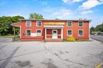 This rare two-for-one property, owned by the same family for nearly 40 years, offers an exceptional opportunity in a highly visible, high-traffic corner location. The main building is a spacious, two-story retail/warehouse structure, previously used as a feed store, offering flexible commercial space ideal for retail, offices, warehousing, or light industrial uses. The warehouse includes a loading and unloading area for added convenience. Just steps away, a charming 3-bedroom, 1-bath colonial-style home, set back from the road and surrounded by mature trees and perennial flowers, provides a peaceful living space. This property is perfect for live/work arrangements, with a detached 2-car garage offering ample storage. With both residential and commercial zoning, the possibilities are endless in this desirable location.