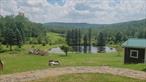 When you step on grounds the property has a resort feel. Mountain and pond views, along with in ground pool, 2300 sqft barn with electric and water, once used for horses to roam the 20 acres , currently used for storage with a full walk up second level. Property consists of both sides of krum road with the Main house sitting across the road with a gated entrance for privacy. House features 5 bedrooms, 4.5 bathrooms, two family rooms with vaulted ceilings. Exterior of the home features multiple gazebo&rsquo;s overlooking the property, fruit trees,  along with a stone pizza oven. Property borders paved rails to trails path with direct access into the Hamlet of Hurleyville for dining, entertainment and more.