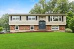 Sun-Filled & Spacious in a Prime Clarkstown Location!Welcome to your homeâ€”bright, inviting, and nestled in one of the most sought-after neighborhoods in Clarkstown, with top-rated schools. As you enter, you&rsquo;re greeted by a welcoming foyer that leads to an open-concept layout filled with natural light. The eat-in kitchen is a standout, featuring plenty of bright white cabinetry, Silestone countertops, a tiled backsplash, and ample room for cooking and gathering. Whether you&rsquo;re preparing meals for loved ones or enjoying morning coffee, this kitchen is a warm and functional centerpiece.The kitchen flows effortlessly into the formal dining room and expansive living room with built in wall unit. This is great for entertaining friends and family. A true highlight of the home is the oversized three-season roomâ€”perfect for relaxing with a book or enjoying the views of the beautiful, level backyard. This enclosed retreat offers a peaceful place to unwind and extends your living space throughout much of the year.On the main floor, youâ€™ll find a spacious primary bedroom with a private en-suite bath and walk in closet. Plus two additional well-sized bedrooms. A beautifully updated full bathroom featuring a skylight adds elegance and natural light. Rich hardwood floors run throughout the main level, enhancing the homeâ€™s warmth and timeless appeal. Customized features throughout the home. Downstairs, the lower-level oversized walk out family room features a full wall brick fireplaceâ€”ideal for movie nights, game days, or simply relaxing on a chilly evening. This level also includes a powder room , tiled flooring, and tons of storage space, plus a bedroom that can customized into a home office, guest space, gym, or whatever suits your lifestyle.The beautifully landscaped yard is perfect for outdoor gatherings, gardening, or relaxing. With an attached 2-car garage, ample parking. All this close to fabulous downtown New City: vibrant shops, dining, and entertainment. Join the Paramount Country Club. Close to parks & town pools. Minutes to the Palisades Parkway, so it&rsquo;s an easy commute into NYC or NJ. You can also take public transportation. A must see home!