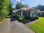 Great starter home or country escape with lake views of swan lake. Excellently maintained home on just shy of 1 acre of land with municipal water and sewer. House features new windows, updated metal roof. Level parcel of land that is about half cleared and half wooded. Garden in the back yard, updated back deck, nice wooded area with views of the lake year round. Inside features 3 bedrooms and 1.5 bathrooms. Two bedrooms are on the main level along with living room and dining area. Wood stove in dining area along with wood burning fireplace in living room. Laundry hookups on main level along with full bathrooms. Upstairs is a finished loft area with 3rd bedroom along with area for office or storage. Half bathroom upstairs for 3rd bedroom along with skylights and views of the back yard. Basement with access to back yard along with mechanicals and additional storage.