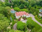 This custom-built brick estate in the highly sought-after Jericho School District offers over 7, 900 square feet of luxurious living space, plus a full walk-out lower level, all set on more than two acres of beautifully landscaped grounds. Behind a dual-gated circular driveway, the home showcases top-quality materials, smart home technology, and radiant heat throughout. Every bedroom is en-suite, including the expansive primary suite, which features a spa-like bathroom and an extraordinary walk-in closet room thatâ€™s a dream come true. The gourmet kitchen is designed for both beauty and function, outfitted with premium appliances and elegant finishes. The lower level is ideal for entertaining, complete with a state-of-the-art home theater, a maidâ€™s room, and a spectacular wet bar. Outside, a heated saltwater pool, cabana, and extensive patio space create a true private resort atmosphere. This exceptional property combines timeless design, cutting-edge features, and resort-style amenitiesâ€”all within the top-rated Jericho School District.
