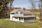 1220 Hunns Lake Rd is perfect as a full-time family home or a weekend escape, ideally located for both tranquility and convenience. This charming early 1900&rsquo;s farmhouse in the serene Shekomeko Valley offers 4 bedrooms, 2 bathrooms, and 1, 344 square feet on 1.52 bucolic acres. The property boasts views of the surrounding countryside and stunning sunsets. Enter the home through the light-drenched wraparound enclosed porch: on the first floor, find a large mudroom adorned with custom wallpaper, full bath, and a spacious kitchen that&rsquo;s wonderful for entertaining. A large dining and living room with wood burning fireplace has French doors that open onto a patio - perfect for al fresco dining. Off of the living room is a cozy family room. Upstairs, you&rsquo;ll find 4 bedrooms and a full bathroom. Original and reclaimed hardwood floors throughout this updated, light-filled country home, which offers Central AC and basement laundry. Outside, a vegetable garden, clawfoot tub, roses, peonies, and plenty of space to picnic with a view.Nature lovers will appreciate the short walk to Wethersfield, where you can explore some of the most beautiful walking trails in the Hudson Valley, while the property itself is landlocked by the Dutchess Land Conservancy, ensuring privacy and natural beauty. Enjoy your own private trail through the woods to a magical clearing with 360 degree Hudson Valley views. Most desirable location for anyone seeking Hudson Valley landscape with convenience to surrounding areas: 2 hours from Manhattan, 10 minutes from Stissing House, 15 minutes from Millbrook, Millerton, and Amenia, 20 minutes from Sharon, CT and Rhinebeck, and minutes from Dutchess Day School, Indian Mountain School, and the prestigious Millbrook School. Available for viewings today!