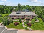 Unrivaled grandeur with an idyllic Tuscan-countryside vibe! Introducing one of Westchester Countyâ€™s most magnificent Estates, beautifully situated high on an exquisite tree-lined rise just minutes from Rye. This private sanctuary is nestled on 5.2 acres of manicured grounds with distant water views of Long Island Sound. Thereâ€™s nothing quite like it: an infinity pool, pool house, guest house, indoor-outdoor jacuzzi, sauna, sun-drenched patios, clay tennis court, bowling alley, gym, wine cellar and a seven-car garage. Plus, adjoining this property is a 2.1-acre vacant level lot of land that is being sold separately. The possibilities are endless! A masterpiece of design, this stunning residence features a soaring 40-foot-high central atrium with a barrel-vaulted ceiling and a suspended walkway. Bathed in natural light from towering walls of glass, this home unfolds gracefully over 4 levels. It offers a welcoming reception room, a stately library, grand living room, a chic dining room and a spacious executive office with built-ins. Multiple rooms open to a glorious rear patio with built-in grill including the chefâ€™s kitchen, sunny breakfast room and the breathtaking Great Room with wet-bar and one of this homeâ€™s four fireplaces. The main residence boasts 7 bedrooms, 8 full bathrooms and 2 powder rooms. The primary suite is one-of-a-kind with a stunning private sundeck, 2 marble ensuites and a myriad of boutique-like dressing rooms and closets. Nothing has been overlooked - thereâ€™s an elevator to all floors, 2 laundries, and a heated driveway for snow melt. This prestigious Estate is minutes from downtown Rye, convenient to Metro-North train and highways to NYC!