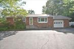 Just Listed in Ronkonkoma! This beautifully maintained 4-bedroom, 2-bath home is set on a spacious half-acre of property, offering a full basement, a 1.5-car attached garage, and a stunning backyard oasis. A circular driveway welcomes you with ample parking. Inside, the entryway boasts marble floors, leading to a large eat-in kitchen and a sunroom that can serve as a sitting area or mudroom. Hardwood floors flow throughout the bedrooms and family room, adding warmth and charm. The primary bedroom includes its own full bath for added privacy and convenience. The roof and skylight are just 3 years young. Outside, enjoy a fully fenced yard featuring a 20x40 inground pool, a tranquil koi pond with a waterfall, and a detached 20x40 garage-perfect for hobbies, storage, or a workshop. The magnificent landscaping creates a peaceful, private retreat. Located on a quiet street yet ideal for commuters, this home is close to schools, parks, shopping, the LIE, LIRR, MacArthur Airport, and is part of the highly regarded Connetquot School District.