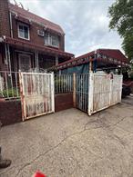 DISCOVER THIS CHARMING BRICK ATTACHED HOME LOCATED IN ONE OF THE MOST UP AND COMING neighborhoods in East ELMHURST Queens. With R3X zoning, this property offers a world of possibilities for the right buyer. The first floor features a spacious living room, formal dining area, kitchen , and a convenient half bath-ideal for entertaining guests. Upstairs you will find three spacious bedrooms and a full bathroom, providing plenty of space for family living.The walk in basement is generously sized with separate entrance leading to the backyard, an attached garage offers added convenience and value. While this home does need some TLC, itâ€™s brimming with potential whether you are looking to renovate for personal use or invest in a promising property. Donâ€™t miss this opportunity to own in one of Queens most rapidly growing areas. The property will deliver vacant and sell AS IS.