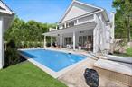 Modern Elegance in Sag Harbor VillageDiscover an exquisite blend of traditional Hamptons elegance and modern craftsmanship in this beautiful new construction located in the renowned Sag Harbor Village and nearby beaches. This 4, 500 sqft. brand-new custom home features six bedrooms on three thoughtfully designed levels. Nestled on a serene .30-acre lot, this architectural gem redefines Hamptons living. Step through the grand entrance into an ideal open layout, where soaring double-height ceilings and expansive glass windows and doors bathe the interiors in natural light. A uniquely designed staircase with glass railings makes a striking statement, seamlessly connecting the homeâ€™s thoughtfully designed levels. At the heart of the home, the stunning chefâ€™s kitchen boasts Wolf appliances, a Sub-Zero fridge/freezer, and a Bosch dishwasher, complemented by quartz countertops. A separate butlerâ€™s pantry with a full-size sink, custom cabinetry, and additional prep space ensures effortless entertaining. The living room features a dramatic wood-burning fireplace with Calacatta marble, creating a warm yet refined ambiance. A wet bar with quartz countertops, and wine fridge enhances the space, perfect for hosting. French doors open to a lovely garden area, and a powder room and en-suite junior suite complete the first level. Retreat upstairs to the primary suite, an oasis of tranquility with vaulted ceilings, custom walk in closets, a stunning bathroom and a private balcony overlooking the pool. This level boasts two additional en-suite bedrooms with ultimate privacy and natural light. As you transition to the finished lower level, you will notice a design that is focused on both relaxation and recreation. Embracing a modern aesthetic; large format porcelain tiles and white marble span the entire floor. Witness two more generous bedrooms, two bathrooms, and an entertainment space with a gas fireplace. No stone was left unturned as this level is complete with a built-in entertainment bar with quartz countertops and wine cooler, as well as a versatile additional space that offers endless possibilities as a gym, office, or playroom with direct access to the yard and pool. Outside, an elegant covered veranda flows seamlessly into the heated Gunite pool, setting the stage for unforgettable gatherings. Designed for all-season enjoyment, this back yard boasts an electric fireplace, ceiling fans, and custom louvre shutters. A BBQ area enhances the outdoor dining experience, while an outdoor shower adds a touch of resort-style luxury. For added flexibility, an oversized detached garage could be converted to a pool house. As an added bonus, the property is equipped with four-zone heating and cooling, and a state-of-the-art security system with Google Nest cameras and thermostats. Do not miss your chance to experience the pinnacle of Hamptons living at this Sag Harbor Village retreat.