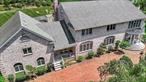 Expansive Laurel Hollow Colonial built with fortitude. Welcome to this custom-built brick Colonial nestled in the heart of Laurel Hollow. Boasting 7 spacious bedrooms and 4.5 baths, this exceptional home offers an abundance of space, comfort, and classic elegance. Enter through the grand double-door entry into a stately marble foyer with a bridal staircase. A traditional layout designed for both everyday living and gracious entertaining. A true chefâ€™s kitchen, featuring an oversized center island, commercial-grade Garland stove, and a charming brick fireplace. A gourmet lovers delight.The first floor includes steps to a private ensuite with its own entrance, plus an additional bedroom, full bath, powder room and laundry room. A classic floorplan including a formal living and dining rooms, and a warm, inviting den with fireplace and gleaming hardwood floors. Upstairs, discover three generously sized bedrooms with oversized closets, a full hall bath, and the serene primary suiteâ€”your private retreat with a sitting area and extra large cedar closet. The finished basement offers endless potential for entertainment, with an incredible amount of space, built in bar, island and outside egress as well as an entrance through the garage. Lovingly maintained by its original owners, this home is a rare opportunity in Laurel Hollow. Heat source is heat pump and or oil, private well water. Enjoy the private Laurel Hollow Beach and Mooring Rights (dues apply). Cold Spring Harbor School District (CSHSD2). If you are looking for an abundance of space, it is available here, in this distinguished residence.