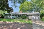 Spacious ranch on large level lot with beautiful mature trees located a very short distance to private association beach on Long Island Sound. Ample room for pool. Three bedrooms, two full baths, open plan kitchen to dining area with wood burning stove. Large living room, full basement, one car attached garage, mud room, hardwood floors and central air conditioning complete the package.
