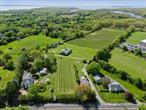 Introducing an excellent opportunity to own a well-cultivated vineyard planted with premium varieties of Sauvignon Blanc, Merlot, and Riesling situated on the North Fork of Long Island. This boutique vineyard supplies grapes to vineyards and breweries, offering an addition to world-class fine wines and craft beverages. A preliminary site plan is available to develop a unique tasting room, enhancing the propertyâ€™s potential. The existing 1800s farmhouse, rich in character, can be integrated into your vineyard vision or removed to suit your design aspirations. A spacious farm-sized barn/stable equipped with electricity and water provides further functional versatility. Set on 17.5 acres of beautiful North Fork agricultural land, the property comes with Development Rights Intact, presenting the opportunity for possible subdivision (buyer to perform due diligence). Ideally located moments from town, school, beaches, shops, transportation, vineyards, and wineries, this property offers exceptional exposure and accessibility. With endless potential, do not miss out on this wonderful opportunity to participate in everything NorthFork has to offer.