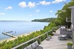Waterfront Compound with 2 DocksLocated on one of the most prestigious beaches on all of Shelter Island is this expansive compound with all the amenities one would want. 332 +/- sandy beach and two docks, breathtaking sunset views from all major rooms, 4 lots, including underwater ownership totaling 1.31 acres, multiple waterfront decks, 4 car garage, game room, regulation size indoor racquet ball court, gym, indoor pool and hot tub and media room. This home could be either a wonderful vacation home or a year round home. Stunning sunsets will bring everyone to the bar-b-que.