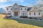 Spectacular 4 Bedroom Center Hall Colonial with over 4, 400 square feet of living space on 2.1 acres in a desirable executive development. This one owner home was built by reputable local builder. Fabulously updated kitchen with quartz counter tops and commercial stainless appliances. Beautiful hardwood floors on first level, family room with fireplace, a huge bonus room with it&rsquo;s own fireplace, a private office and full bath. Upstairs are 3 good sized bedrooms and a Master Suite with tray ceilings and recently updated en suite. Lower level includes a second kitchen, family room and full bath with sliders to beautiful stone patio. If you are looking for that special home, this is it! Additional Information: New Water Heater, AC only 2 years old with heat pump, new well pump , wired for Hot Tub and Generator and 3 Car Attached Garage.