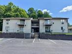 Welcome to this beautiful condo in the Buttonwood Hills complex! This bright and spacious unit features a combined living and dining area with sliding doors that lead to a private deckâ€”perfect for relaxing or enjoying your morning coffee. The kitchen is equipped with stainless steel appliances. There is one generously sized bedroom and one full bathroom, tastefully upgraded with modern finishes, including a glass-enclosed shower and stylish vanity. A convenient in-unit washer and dryer. Additional highlights includes Newly installed (2023) hardwood floors and fresh paint, two efficient LG wall A/C units, modern LED ceiling lights, a range hood, and a smart deadbolt lock. The community offers a swimming pool for your enjoyment and offers maintenance-free living with the HOA covering lawn care and snow removal. Conveniently located near major highways, parks, restaurants, shopping, and schools. Schedule your private showing today!