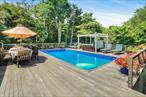 Newly renovated four bedrooms, two bath with a heated pool . Front porch relaxing in the sun or rain. Gorgeous pool deck with hot tub.