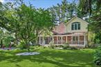 This is a premier curb-appeal, totally unique full 3 level property in Clarkstown School District, featuring a modern imported custom eat-in euro kitchen, with a huge black galaxy granite island and countertops, double convection oven, stainless steel appliances, 4 oversized bedrooms (2 primary with his and her walk-in closets), cathedral ceilings, 3 bathrooms(1 with radian heated floors) which features imported custom tile-work and vanities, wood-paneled enormous family /rec room plus a bonus room, professional office, bay window in living room, sunken dinning room with floor-to-ceiling stone fireplace and french windows framed by a masterfully landscaped gem of secluded flower-filled yard, large second floor deck overlooking a 9 foot deep in-ground gunite swimming pool, Other amenities include pantry, dual system central ac/heat,  washer and dryer, huge windows-windows-windows and recessed light throughout, front porch, 2 car garage, store galore , plus cabana. pergola, large equipment shed