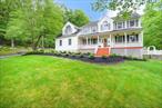 Welcome to this stunning and spacious four-bedroom, 2.5-bath colonial with over 3200 sqft of living space, set back from the road on over 19 private acres with a picturesque tree-lined driveway. This beautifully updated, move-in ready home offers a perfect blend of comfort, functionality, and timeless charm. Step into the bright and airy family room featuring soaring cathedral ceilings, a cozy gas fireplace, and a striking herringbone tile designâ€”an ideal space for relaxing or entertaining. Sliders lead to an oversized deck with easy access to a stone patio, creating the ultimate outdoor entertaining space. The updated kitchen boasts granite countertops and seamlessly flows into a formal dining room and a formal living room, providing elegant areas for hosting gatherings. A dedicated home office offers a quiet retreat for remote work, with plenty of additional space for a home gym or hobbies. Upstairs, the expansive primary suite includes a luxurious en suite bath, a walk-in closet, and a separate dressing room. Three additional oversized bedrooms and an updated full bath provide ample space for family and guests. Additional highlights include an unfinished walkout basement with endless potential, two-car garage, pool with surrounding patio perfect for summer fun. Enjoy the serenity of country living without sacrificing convenienceâ€”this exceptional property is just minutes from shopping, major highways, and the train station for easy commuting. Donâ€™t miss the chance to own this one-of-a-kind home that truly has it all!