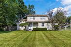 Welcome to 84 College Avenue, Nanuet, NY 10954 Spacious. Bright. Ideally Located. This well-maintained Colonial offers 3 bedrooms, 2.5 bathrooms, and nearly 2, 000 sq ft of living space in the top-rated Nanuet School District, just 35 minutes from the Bronx and under 40 to Manhattan.Soaring cathedral ceilings and large windows fill the living and dining rooms with natural light, while the open-concept layout leads into a warm and inviting kitchen and family room, perfect for everyday living and entertaining.Hardwood floors are believed to be under the carpet on the main level, offering easy potential to customize the space. Upstairs features generously sized bedrooms and a serene primary suite. A main-level laundry room, attached garage, and carport add convenience.Enjoy a private fenced backyard with a wood deck, garden pond, and a cozy front porch, all just minutes from parks, shopping, and express transit into NYC.