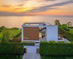 Cutchogue Showstopper!Designed by world-renowned architects Barnes Coy, this modern waterfront masterpiece is a rare blend of cutting-edge design and natural beauty. Perched atop a 55-foot bluff overlooking the Long Island Sound, this 4, 200 sq ft home offers breathtaking sunsets and a seamless fusion of sleek modern lines with warm, inviting elements. Located in a private neighborhood with its own park and private stairs to the beach!Flooded with natural light and crafted from premium materials, every detail speaks to exceptional quality and thoughtful design. Enjoy resort-style living with a heated saltwater gunite pool and hot tub, all set against the dramatic backdrop of open water views. A 1, 000+ sq ft rooftop deck provides panoramic vistas and the perfect space for entertaining or relaxing under the stars. Inside and out, the home is equipped with state-of-the-art smart home technology and integrated speakers, enhancing both convenience and ambiance. Truly one of the most extraordinary homes ever offered on the North Fork - modern, majestic, and simply unforgettable.
