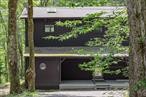 Tucked into the trees and hidden from the world, this contemporary home in Pine Hill, NY feels less like a house and more like a very tasteful treehouseâ€”equal parts functional zen temple and year-round escape hatch. Thereâ€™s even a second parcel included in the sale to protect your privacy. Quiet, secluded, and staring straight at Belleayre Mountain, itâ€™s a home designed to help you actually breathe again.Architect-designed with intention, the home reflects a deep respect for nature, simplicity, and the shifting moods of the Catskills. The renovation was thorough and intentionalâ€”modernizing the layout, upgrading the systems, and dialing in the kind of clean, thoughtful design that doesnâ€™t scream for attention but earns it over time. Itâ€™s deeply, deliciously quiet here. Every window frames the forest like itâ€™s art, and every room is a slow-moving sundial, shaped by shifting light, shadow, and season.The aesthetic leans Japanese-inspired, forest-forward, and blissfully uncluttered. The primary bathroom is your onsen-in-the-woods fantasy brought to lifeâ€”black, white, and grey tiles set the stage while the XL picture window over the tub frames a leafy live mural that changes with the seasons. Radiant heated floors keep your toes warm in the winter months. Mirrors reflect the trees back at you. The shower has a front-row seat to the forest. Itâ€™s all very sereneâ€”but also very cool.The kitchen has been opened and modernized, now fully integrated with the living and dining areas. With sleek hidden paneled appliances, an induction cooktop, Bosch refrigerator, and storage that actually makes sense. It flows seamlessly into the living and dining area, where four oversized windows let in the breeze, the sun, and the occasional wildlife sighting. The main living space is expansive yet calming, anchored by a wood stove at one end and a large deck off the backâ€”because you will want a cocktail at golden hour and a chair to drink it in.Upstairs, thereâ€™s a full bath, again with heated floors, and two bedrooms with winter views of Belleayre just to remind you how close the slopes are. New windows throughout make sure you never miss a mood shift in the woods, and the whole house is wrapped in the kind of silence you forgot existed.Outside, the vibe is all Catskills sanctuary. The house is wrapped in woods, offering full seclusion and the kind of quiet that makes you forget your phone exists. A large back deck is perfect for sunset drinks, yoga with the trees, or just staring into the forest alone. Out front, a covered porch gives you a place to sip your coffee while listening to birds instead of Slack notifications. Itâ€™s private, peaceful, and low-maintenanceâ€”because natureâ€™s already done most of the decorating.You wonâ€™t want to miss Doolittleâ€™s for your pantry items, dinner at The Pines or Peekamoose Restaurant, or a cocktail at The Print House. Hike at Rochester Hollow Trail, Dry Brook Ridge Trail, or Mount Tremper Fire Tower Trail for excellent trails with dream vistas. This is not a place that shouts. It reveals itself slowly, quietly, and with grace. Itâ€™s the antidote to everything that buzzes, pings, or scrolls. Itâ€™s stylish, peaceful, and private. And if it feels a little too calm? Donâ€™t worryâ€”thereâ€™s a ski mountain across the way.