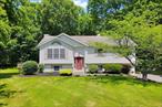 Move right in to this beautiful custom built raised ranch with 4 bedrooms and 2 1/2 baths built by the original owner on 1.3 acres of manicured gardens and parklike land on a private cul-de-sac. Large 2 tier deck with a hot tub and an above ground pool perfect for outdoor enjoyment and entertaining. All this in the highly sought after Goshen school district. The first floor offers an open floor plan kitchen with stainless steel appliances, living room and dining room with cathedral ceilings. Main bedroom with full ceramic tile bath,  2 additional bedrooms and a second full bath. Hardwood floors. Many closets. The lower level has a family room, laundry room, 1/2 bath, a large bedroom with sliding doors that leads to a beautiful stone patio area and an additional room presently used as a 5th bedroom that can be used as a den/office. Central air. Close to parks, restaurants, shopping & major highways to NYC.