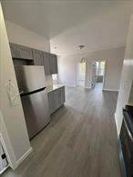 Fully renovated 3-bedroom apartment featuring a modern kitchen with stainless steel appliances, sleek finishes, and a split system for both heating and A/C. Move-in ready with a fresh, contemporary feel throughout.