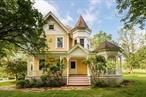 Itâ€™s tempting to lead with the long list of amenitiesâ€”heated pool, tennis court, wine cellar, guest houseâ€”but the true appeal of the Stephenson House lies in the grounded, gracious lifestyle it fosters. Set on 20 scenic Catskills acres, this 1890s yellow Victorian blends heritage charm and modern ease, from its romantic turret and wraparound porch to stone walls and sunlit meadows. The main house features a chefâ€™s kitchen with honed granite counters, a stone fireplace built from on-site rock, a walk-in pantry, and a mudroom with utility sink. A hallway lined with original stone leads to a cozy wine room. Upstairs, the bright primary suite includes double pedestal sinks and a clawfoot tub in a bay window nook. Three additional bedrooms, hardwood floors, and generous windows create a warm, light-filled home. A 1, 770 sq ft guest house adds versatility with a soaring yoga studio and a 1-bedroom apartment opening to landscaped patios. It also serves as a pool house beside the large (53x20ft) heated swimming pool with outdoor shower. The extensive 1800s barns offer stalls, climate-controlled storage, and ample space for livestock or hobbies. Open fields invite riding, hiking, and ATV use. A tennis court and archery area round out the recreational offerings. Minutes from Bethel Woods and convenient to Jeffersonville and Narrowsburg, this rare legacy property is ideal for retreat, recreation, or refined country living.