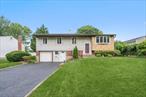 Spacious 5 bedroom High-ranch, Lower level with outside entrance. Updated kitchen, Wood floors, Solar panels, Guest quarters. Huge back yard.