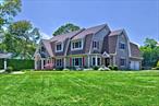 Welcome to an exceptionally maintained pristine home on the edge of the Hamptons where uncompromising craftmanship and serenity meets sophistication in East Moriches. Discover this lushly landscaped 4, 476 sq. ft home on .73 acres which exhumes a perfect blend of elegance and modern comfort. Step inside to discover a bright open floor plan accentuated by 12 foot ceilings, 60 high hats, central vacuum, and oak floors throughout the main level, The beautiful chef&rsquo;s State of the Art Gourmet eat in kitchen with large glass sliding doors provides access to the inground pool, hot tub, and a spacious patio covered with a beautiful pergola. Viking appliances, Quartz countertops, and a large island invites family and friends to enjoy meals and quality time in comfort with the new Central Air system. The kitchen flows seamlessly into the family room complete with a cozy Soapstone fireplace. Additional highlights include a large dining room, an office/workout room, two half baths, access to the full basement, first floor bedroom suite providing flexibility for guests or multi-generational living with outside entrance. The home is equipped with a security system, backup generator, and a two-car attached garage. Step outside to a serene private entertainer&rsquo;s dream boasting a large TV, speakers for your favorite music, with 2 pergolas, a large patio, inground pool with new liner, Loop-loc cover and Robot Vacuum, as well as a child safety fence around the pool and professional landscape lighting and irrigation system. This home combines luxury and tranquility in a picturesque setting, offering a unique opportunity to live in one of the most charming communities on Long Island. Located just 70 miles from NYC with close proximity to the Hamptons, this home is zoned for the highly regarded East Moriches Blue Ribbon schools, with your choice of high schools including Westhampton Beach. Don&rsquo;t miss this rare opportunity to discover your next home!