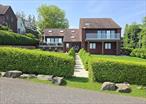 Magnificent Updated Contemporary Home That overlooks the Long Island Sound & has Access to the Beach, Features 4 Bedrooms And 2.5 Baths, Living rm with large windows vaulted ceilings and Skylights, Updated Eat in Kitchen with newer Stainless steel appliances, Bosh induction cooktop, wall ovens, Microwave in a drawer in the Island, Samsung Refrigerator with triple cooling, Wine Cooler and plenty of cabinets and counterspace. Formal Dining room with room for all your guests, Den with fireplace, Primary bedroom suite that overlooks the water, has a large bathroom with Heated Floors, double vanity, Shower of your dreams, and Bidet. finished Basement with room for exercise equipment, Movie watching, ping pong and hobbies. 2 Electric panels 250 Amps/each. Central Air Conditioning, Ground level has heated floors. Oil tank is located in the basement.