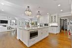 Rare Opportunity to Own a Storybook Estate of Enduring Elegance and Modern LuxurySet on 2.08 manicured acres within the exclusive grounds of the Westchester Country Club, this exquisitely renovated 1929 stone manor offers over 9, 300 square feet of refined living spaceâ€”seamlessly blending timeless architectural details with todayâ€™s most desirable amenities, including 7 car garage/golf simulator room. Privately sited on a quiet, tree-lined street in the coveted Rye Post Office area of Harrison, this estate is a true sanctuaryâ€”ideally located just minutes from top-rated schools, fine dining, shopping, and adjacent to world-class golf, with a convenient 40-minute commute to Manhattan.Originally reimagined by the acclaimed Grasso Development Corp., the 7-bedroom, 8.1-bath residence exudes both Old World romance and modern sophistication. The formal living room showcases leaded-glass window and doors, an original fireplace with hand-hewn millwork, and elegant proportions throughout. A chefâ€™s kitchen, outfitted with top-of-the-line appliances, two dishwashers, a Carrara marble island, and a sizable butlerâ€™s pantry, opens to an expansive, sun-drenched family room featuring a coffered ceiling and custom built-insâ€”perfect for casual living and effortless entertaining.Designed with versatility and lifestyle in mind, the home includes a richly appointed den, a private office, a guest suite, and a series of terraces that provide a seamless indoor-outdoor flow.The serene primary suite is a true retreat, featuring a vaulted ceiling, striking gas fireplace, original leaded-glass doors, custom closets with built-in shelving and drawers, a spa-like bath with radiant-heated floors, steam shower, and a tranquil sleeping porch overlooking the magnificent grounds with views of the Westchester Country Clubâ€™s South Course.The entire walkout finished lower level boasts radiant-heated floors and includes a custom-built 1, 500-bottle wine cellar, full bath, and flexible space ideal for wellness, recreation, or entertaining.Car enthusiasts and leisure seekers alike will appreciate the homeâ€™s iconic porte-cochere as well as, the rare 7-car garage configuration: a temperature-controlled 3-car auxiliary garage with a fully outfitted golf simulator, plus four additional heated garage bays.Curated finishes, Marvin Windows and Doors, elevator-ready shaft present on each floor, currently configured as additional storage closets and energy-efficient upgrades round out this extraordinary offering.For those who value architectural integrity, refined craftsmanship, and a peaceful lifestyle in one of Westchesterâ€™s most prestigious communities, this estate is truly unmatched.
